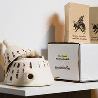Bee Art by Dylan McLernon, featuring a cermaic beehive and a bee illustration