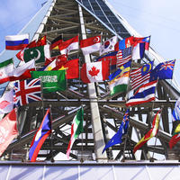 Flags from different countries are hung outside of a building