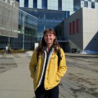 French studies student Bailey Diakow stands in front of the TFDL library