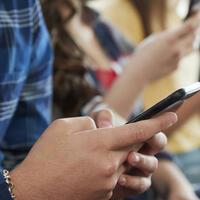 people using their phones