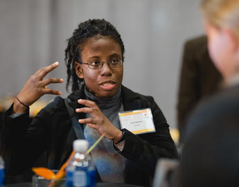 Arts Alumna Toni Palmer talks to a colleague at the UCalgary Arch Awards
