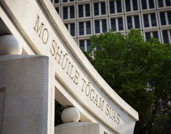 Photo of the University's motto: Mo Shuile Togam Suas (we will life up our eyes) on a monument