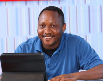 An older student works on a tablet