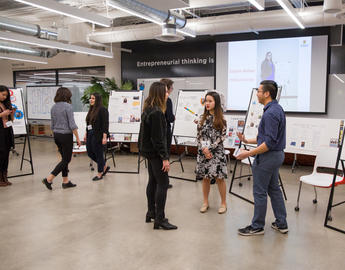Students and prospective employers chat at the Discover Arts 'reverse career fair' event