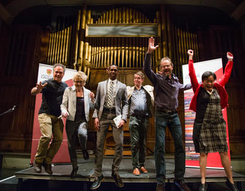 Past wrtiers-in-residence leap on stage together