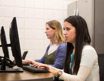 Clinic trainees work in one of the training rooms