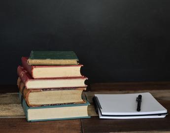 Books and a pen and notebook